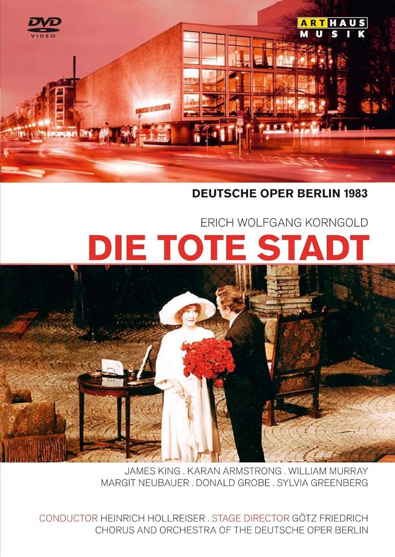 DVD-Cover der Oper 'Die tote Stadt' an der Deutschen Oper Berlin mit Szenenbild und Außenansicht.