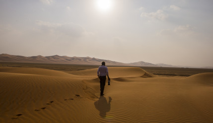 Dirk walking in the Rub Al Khali (Empty Quarter) | photographed in the Saudi Arabian desert of Rub Al Khali, the so-called Empty Quarter | ©2014